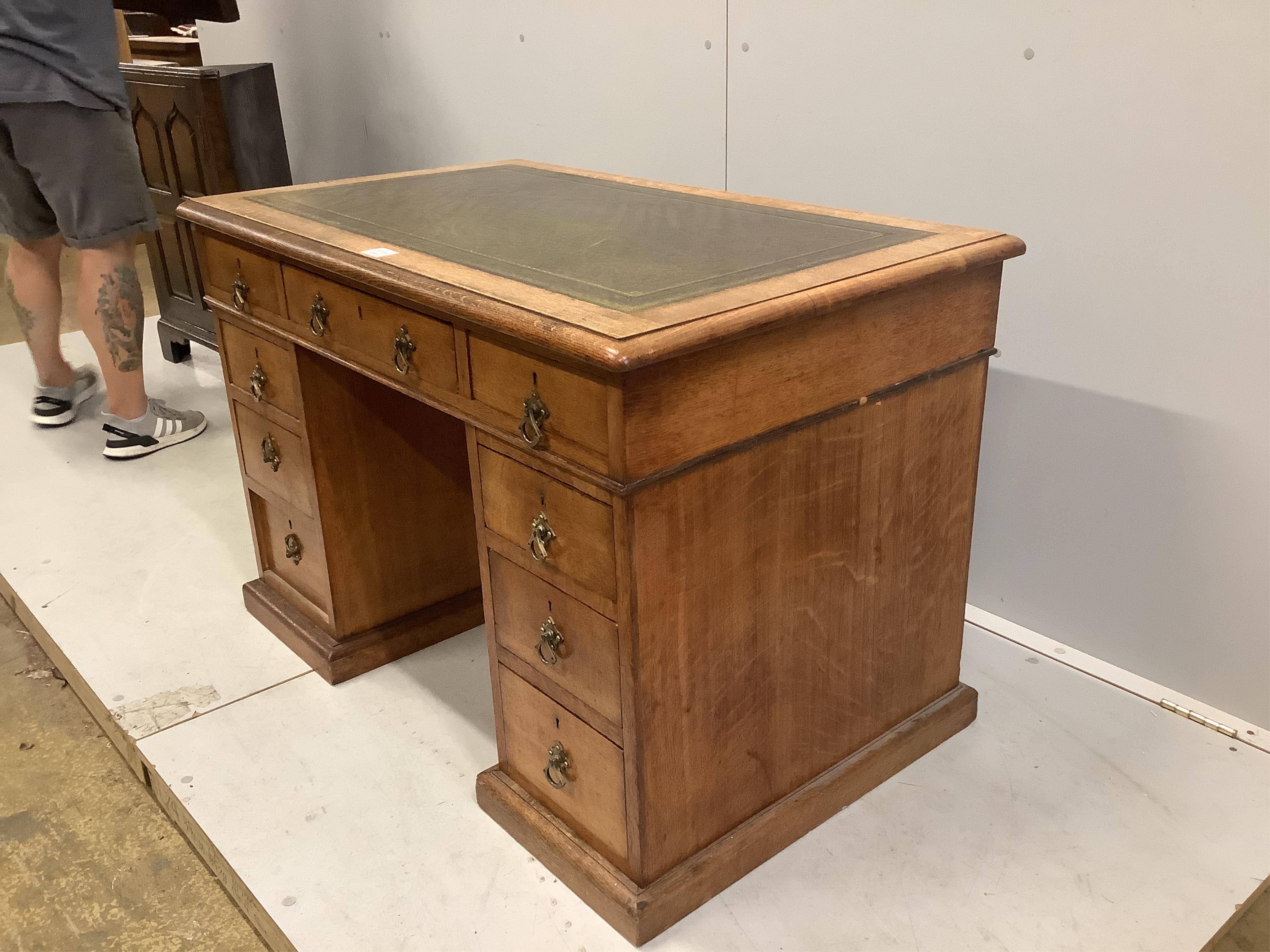 A late Victorian oak pedestal desk, width 106cm, depth 65cm, height 71cm. Condition - fair